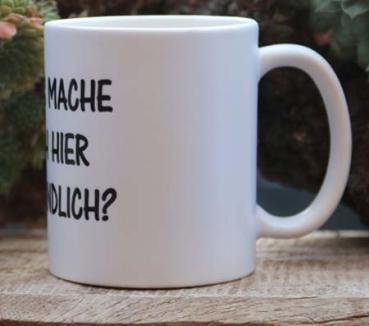 Weiße Tasse mit Spruch "Was mache ich hier eigentlich"